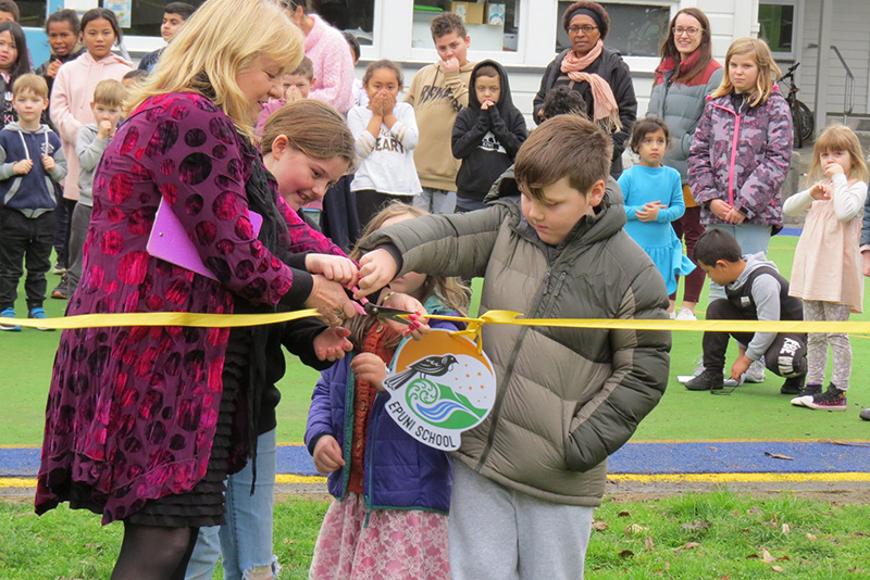 Mrs Evans and pupils open the new playground